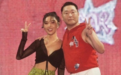 MAMAMOO’s Hwasa Signs With P NATION On Stage During Surprise Appearance At PSY’s Concert