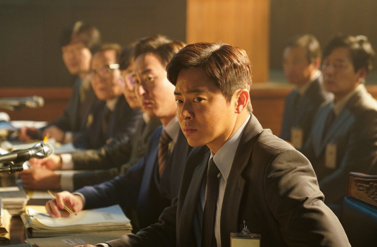 Jo Jung Suk, Lee Sun Gyun, And Yoo Jae Myung Are Entangled In An Assassination Case In Upcoming Film “The Land Of Happiness”