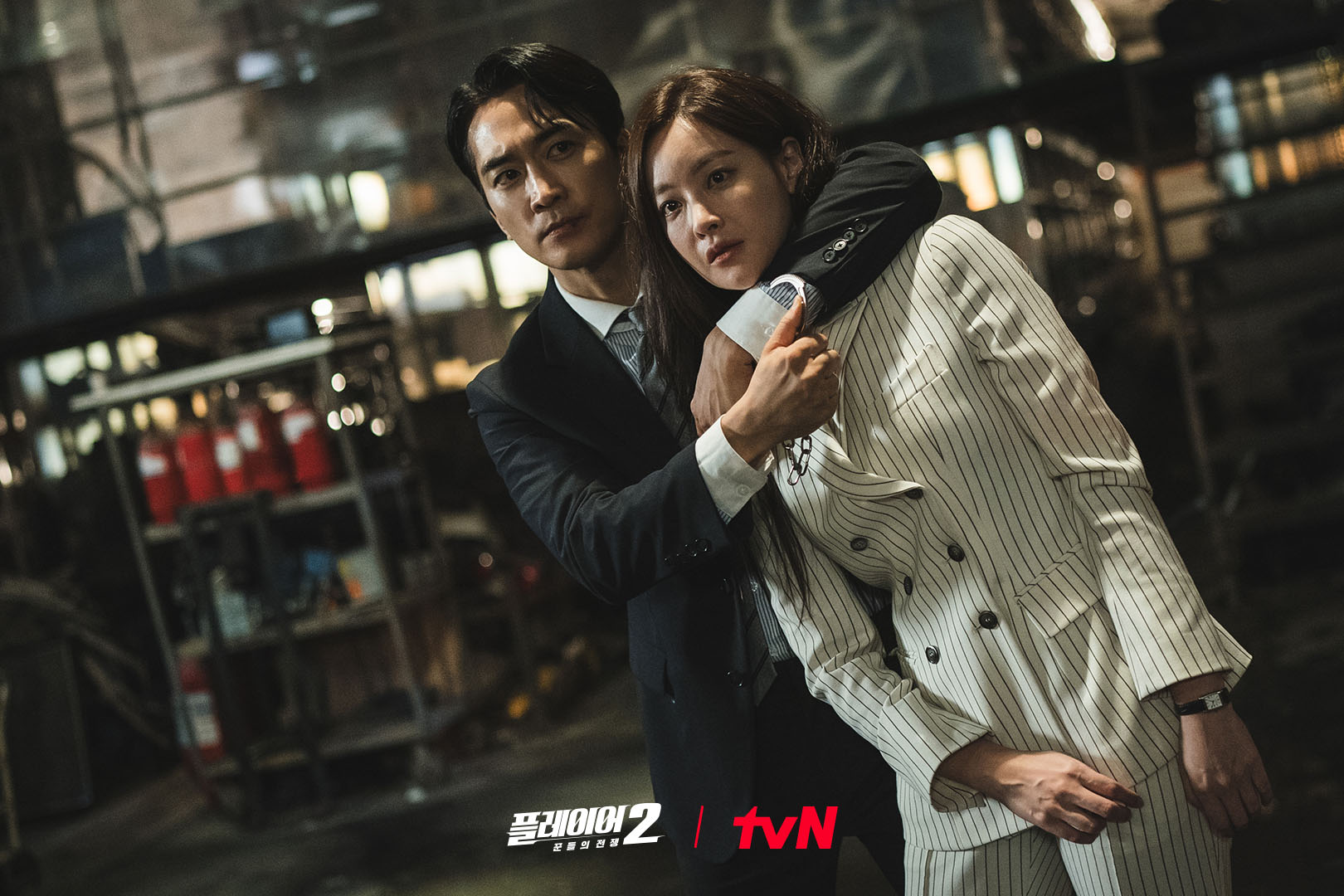 Song Seung Heon Takes Oh Yeon Seo Hostage In “The Player 2: Master Of Swindlers”